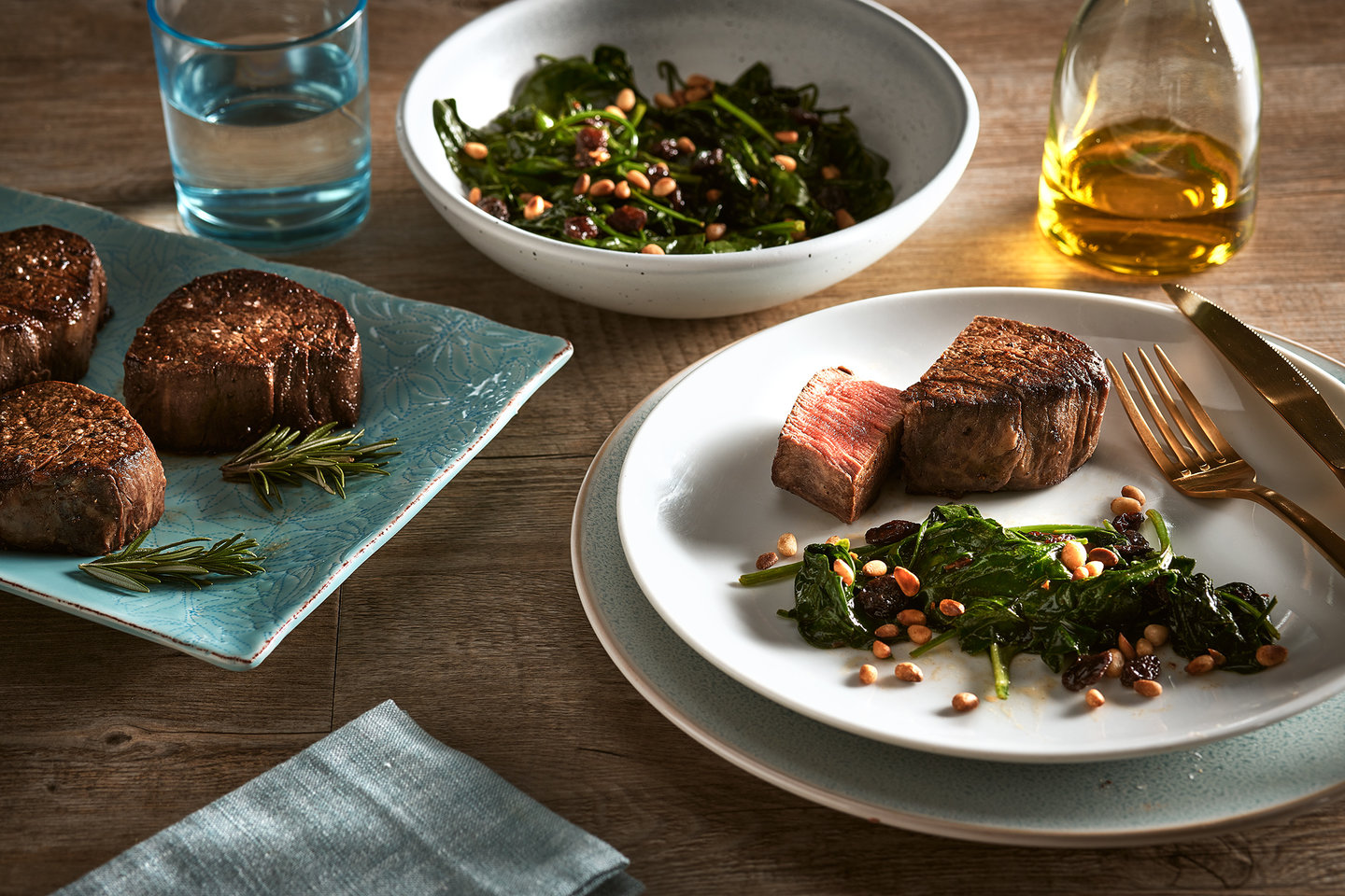 Hero image for Reverse-seared Wagyu eye fillet with buttered spinach, pine nuts and raisins